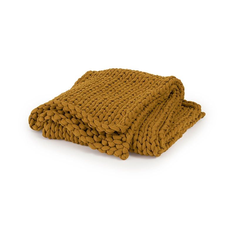 A folded chunky-knit blanket by Bearaby