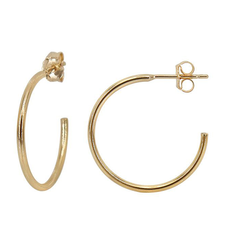 Gold hoop earrings with a butterfly clasp