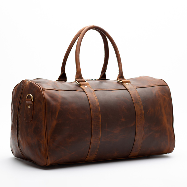 a photo of a brown leather duffle bag 