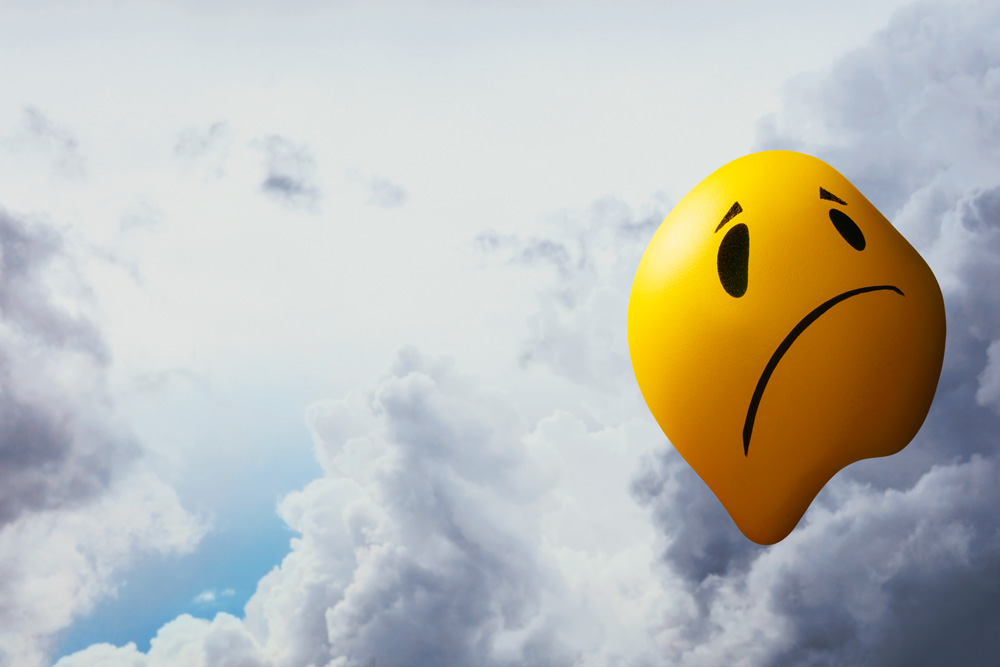 An illustration of a smiling face frowning depicting the cannabis crash